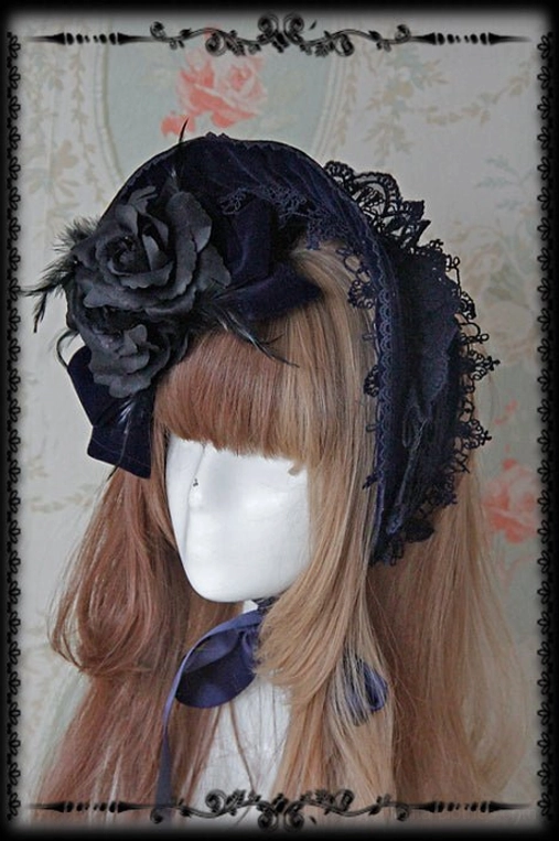 Gothic Lolita velvet bonnet detailed construction view showing lace trim quality, bow embellishments, and fabric rose applications
