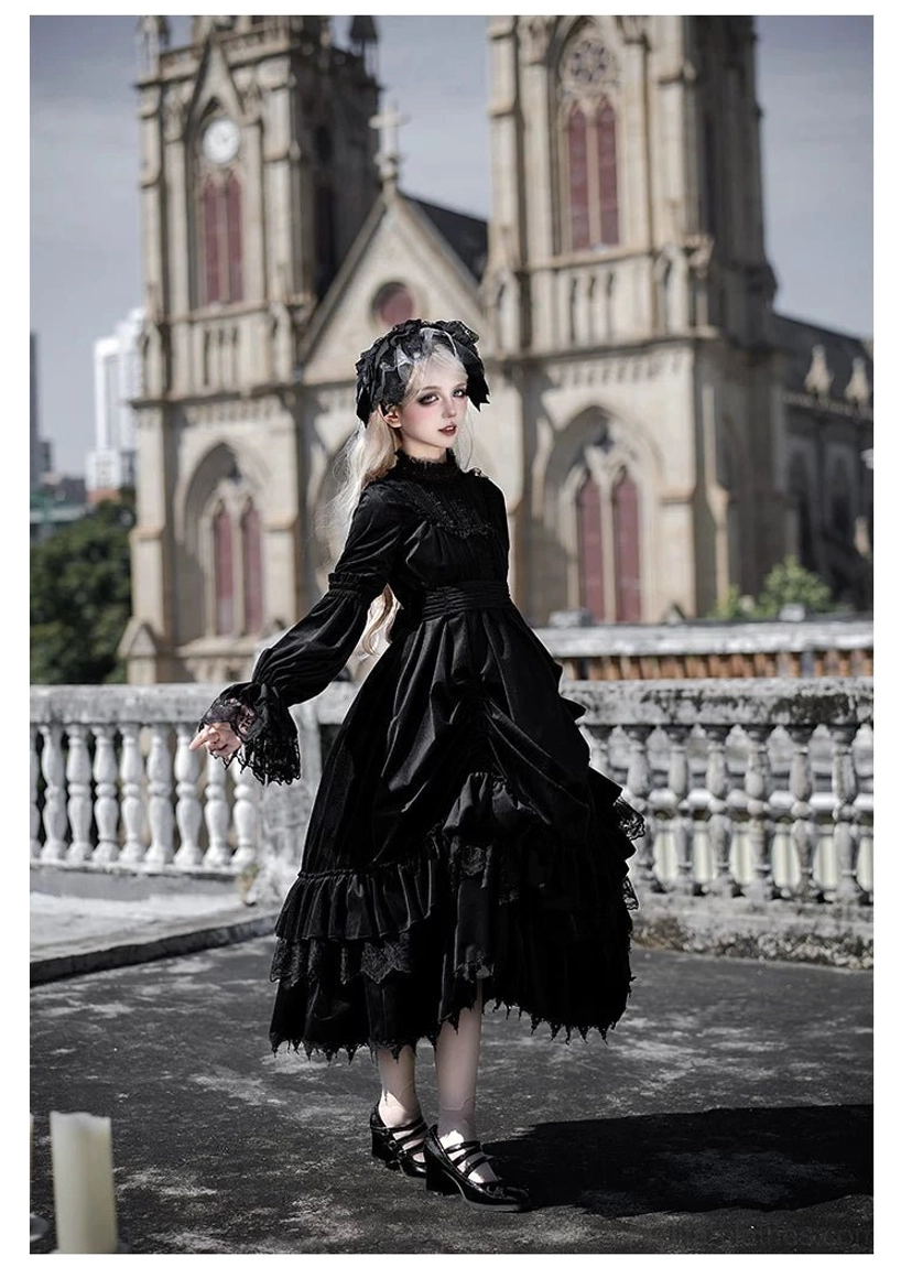 Black gothic lolita velvet OP dress flat lay showing overall garment construction, sleeve length and bodice structure with detachable waist tie