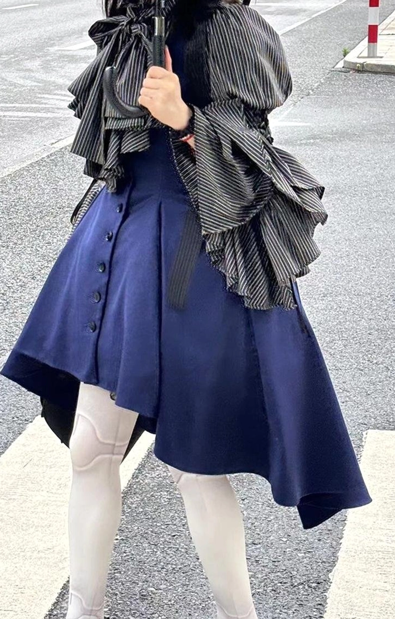 Front full-body view of person wearing white and black striped Gothic Lolita blouse demonstrating proportions and silhouette with complete outfit coordination styling
