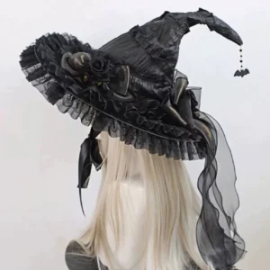 Gothic Lolita witch hat front three-quarter view on blonde wig mannequin with pointed silhouette black lace ruffle brim bat charm pendant and sheer black veil