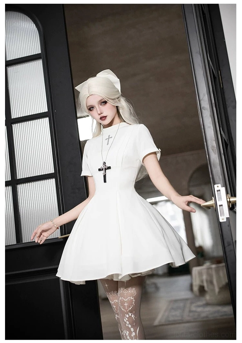 Gothic nun lolita dress cross embroidery bodice detail close-up religious iconography