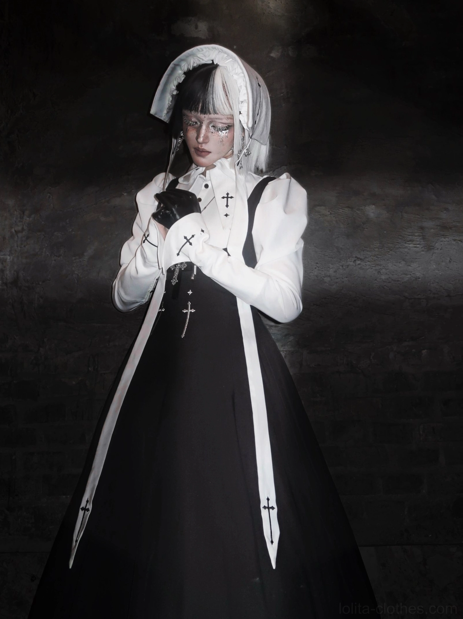 Gothic nun lolita JSK coordinate ensemble showing cross embroidery craftsmanship on collar and decorative elements with black-white color blocking