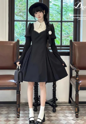 Gothic nun-style lolita one-piece dress front view with model wearing side braids and black bow hat in vintage indoor setting showing contrast white collar and sweetheart neckline