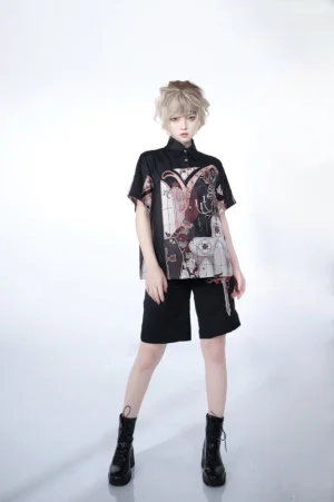 Gothic Ouji short sleeve blouse with skeleton church print worn with black shorts and combat boots full body front pose studio
