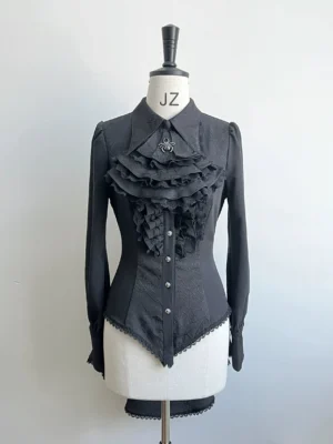 Black gothic Ouji lolita shirt with spiderweb jacquard pattern displayed on dress form front view showing ruffled lace placket and pearl button closures