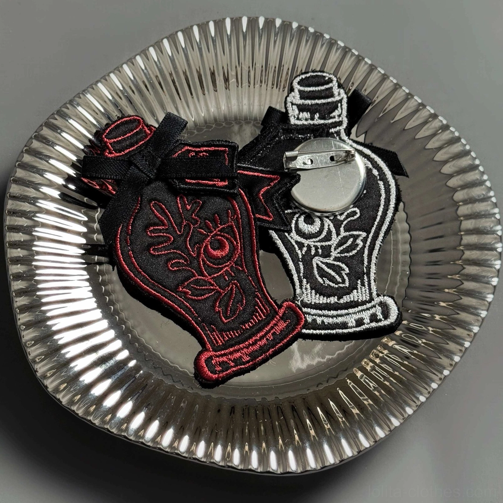 Two gothic potion embroidered badges brooches burgundy and silver-white color variations comparison
