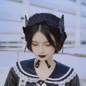 Gothic lolita hairband on model wearing sailor-style dress outdoor rooftop setting with black lace headband wing decorations and chin-fixed strap