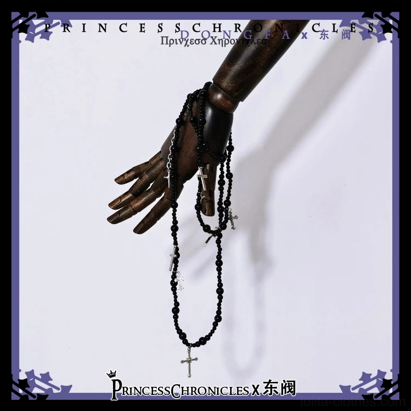 Gothic rosary black beaded chain cross pendant matching ouji lolita accessory wooden mannequin hand close-up detail