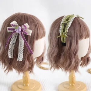 Pair of lolita grapery hair accessories displayed on mannequin bob wigs showing lace ribbon bow with grape decoration and olive green lace headband side profile