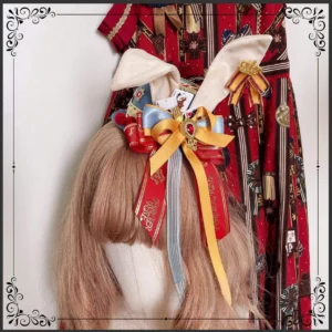 Gray-blue circus bunny ear Lolita top hat with red ribbons and playing card details displayed on mannequin with matching red gold Lolita dress overhead view