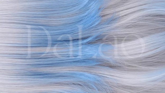 Left side three-quarter view of gray-to-blue ombre lolita wig with single blue hair clip, wavy layers, and side ponytail styling option