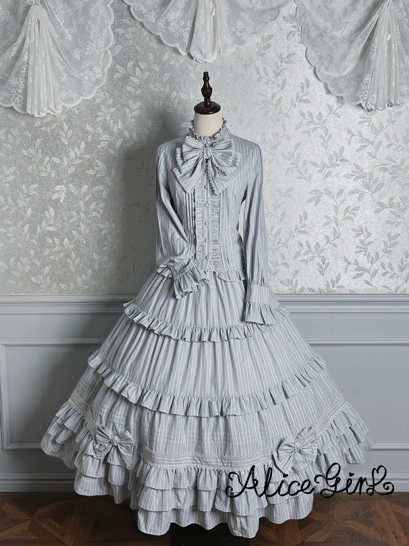 Flat lay display of gray-blue striped lolita blouse showing overall garment construction