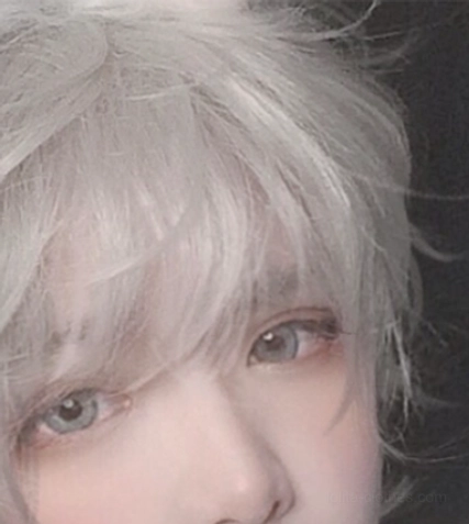Styled flat lay of silver gray curly ouji wig with fluffy rabbit ears and included accessories kit