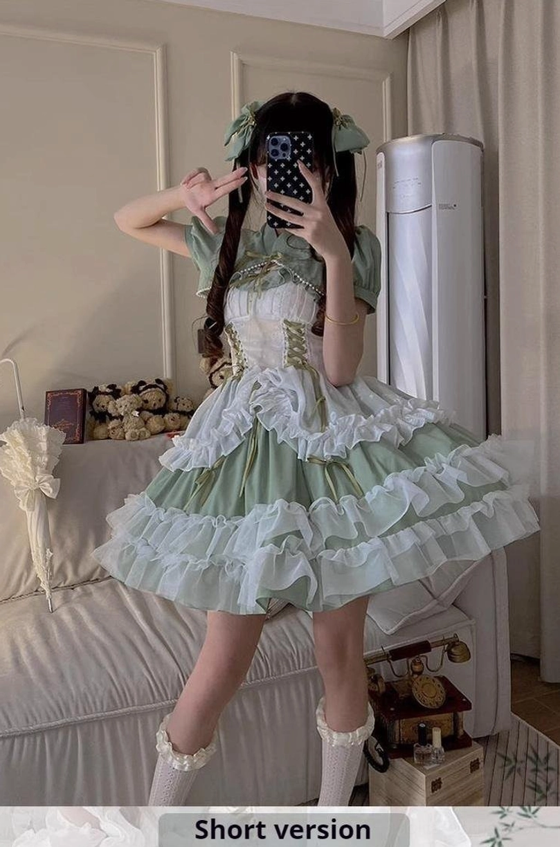 Sage green bridal lolita JSK dress detail showing white ruffled petticoat construction, layered hem design, and elegant lace overlay for romantic aesthetic