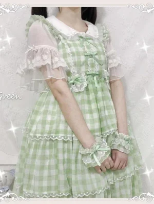 Green gingham plaid Lolita JSK with Peter Pan collar, delicate lace trims, chest bow decorations and wrist bow details in close-up upper-body view