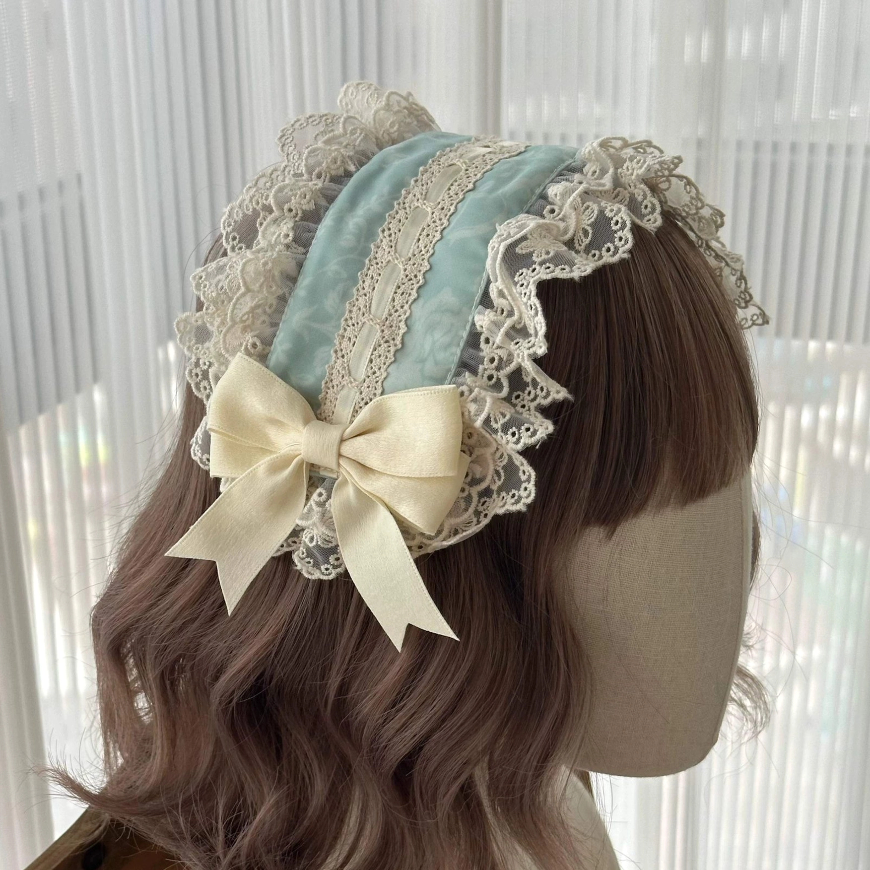 green headband with duckbill clip securing lolita hairstyle hair accessory styling solution