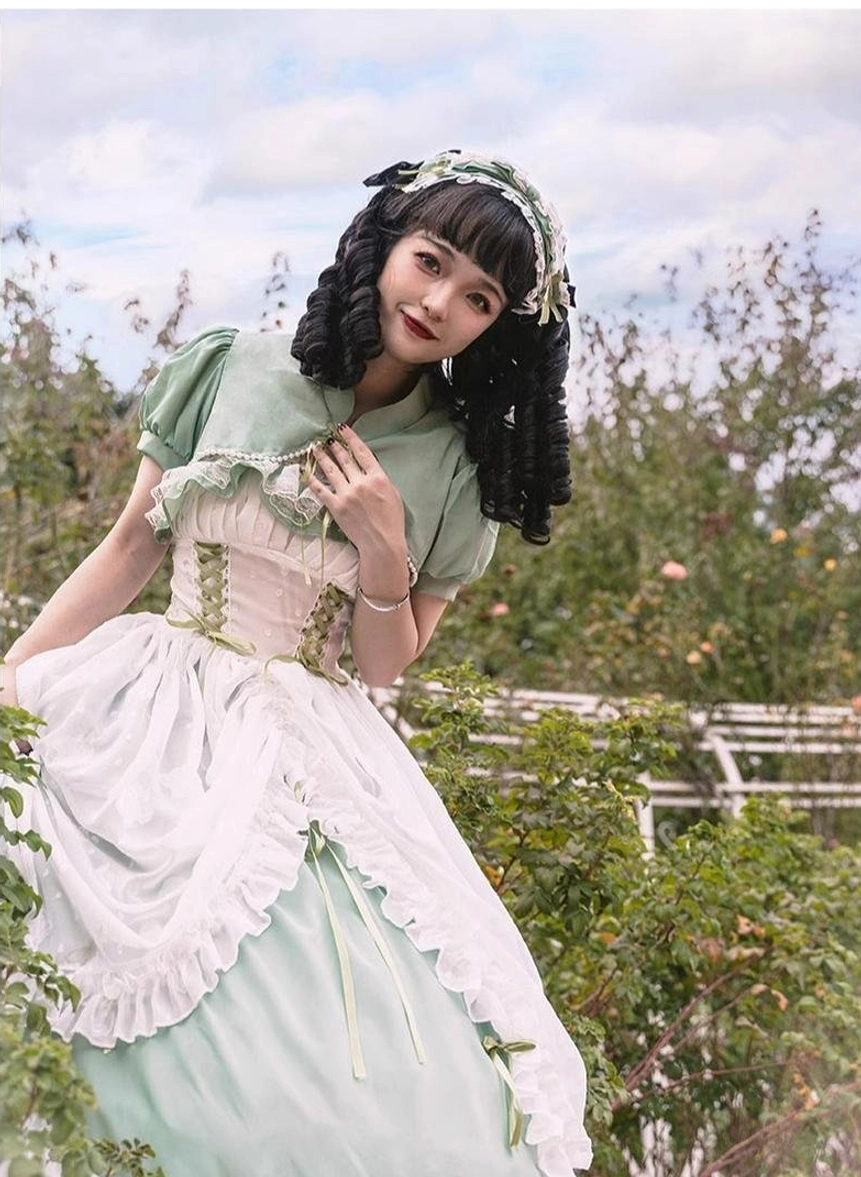 Sage green lolita wedding JSK dress with adjustable features highlighted: elastic straps, drawstring waist, and flexible back panel for customizable fit on plus-size body