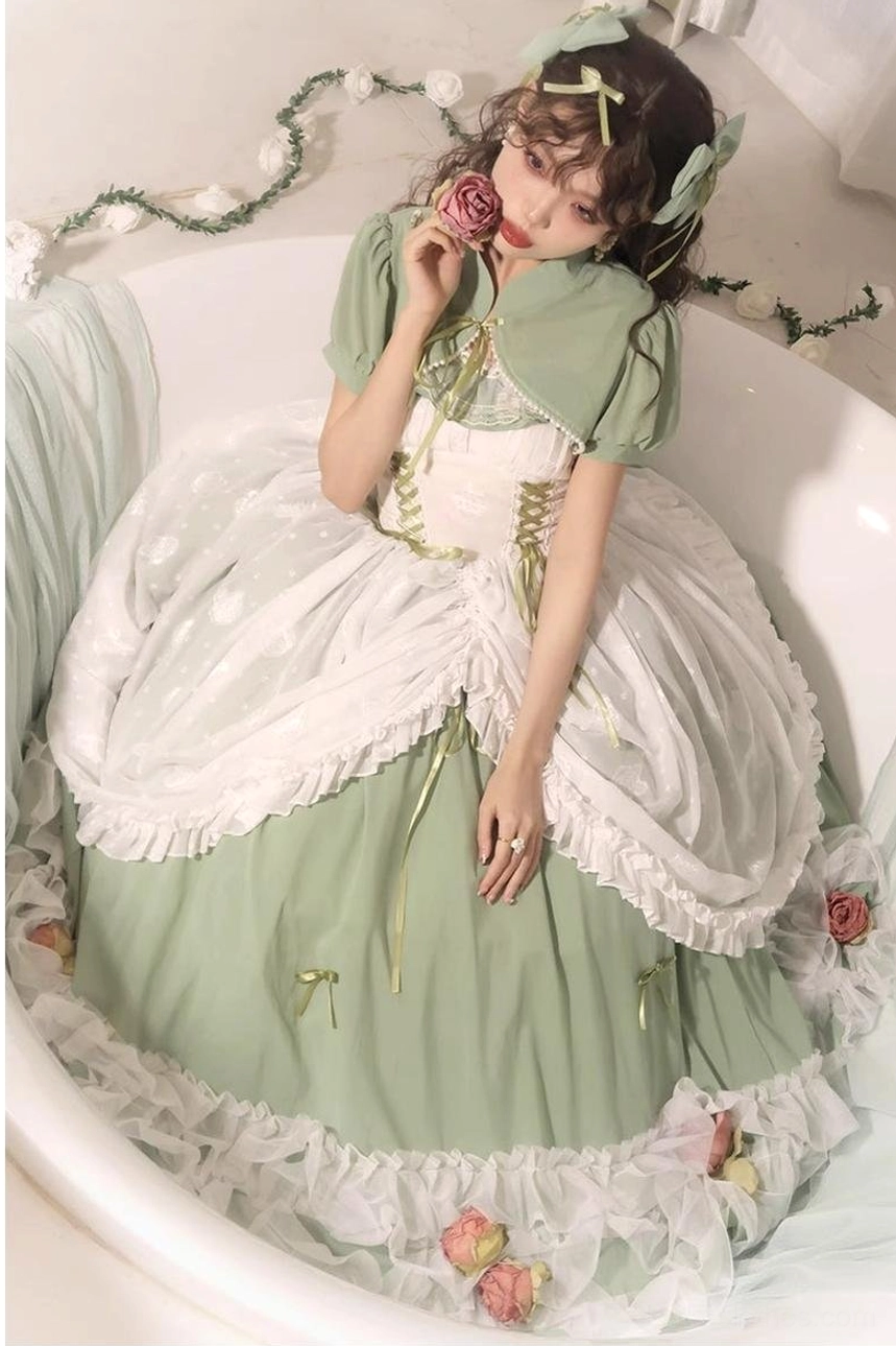 Upper-body and skirt close-up of sage green bridal lolita JSK with white ruffled hem, square neckline, corset bodice, and decorative rose elements