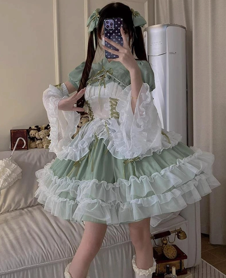 Sage green plus size bridal lolita JSK with three complimentary ribbon bows and hem details showing included accessories and value proposition of dress
