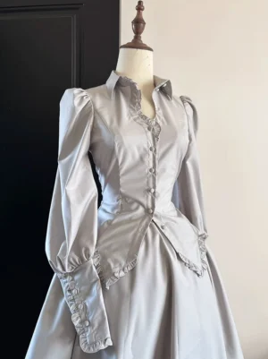 Grey gothic lolita shirt and skirt set with lace-trimmed collar and corset waist, smooth satin fabric with floor-length skirt on mannequin