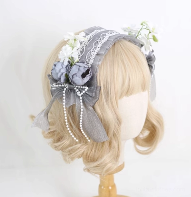 Grey lolita floral lace headband with retaining clip on mannequin displaying elegant design elements