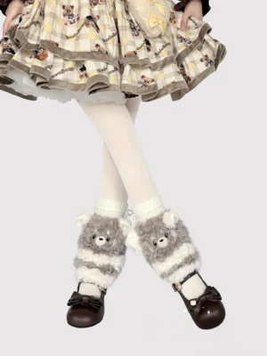 Grey-white striped plush bear leg warmers with minimalist face design side front view on model wearing tartan Lolita skirt and Mary Jane shoes