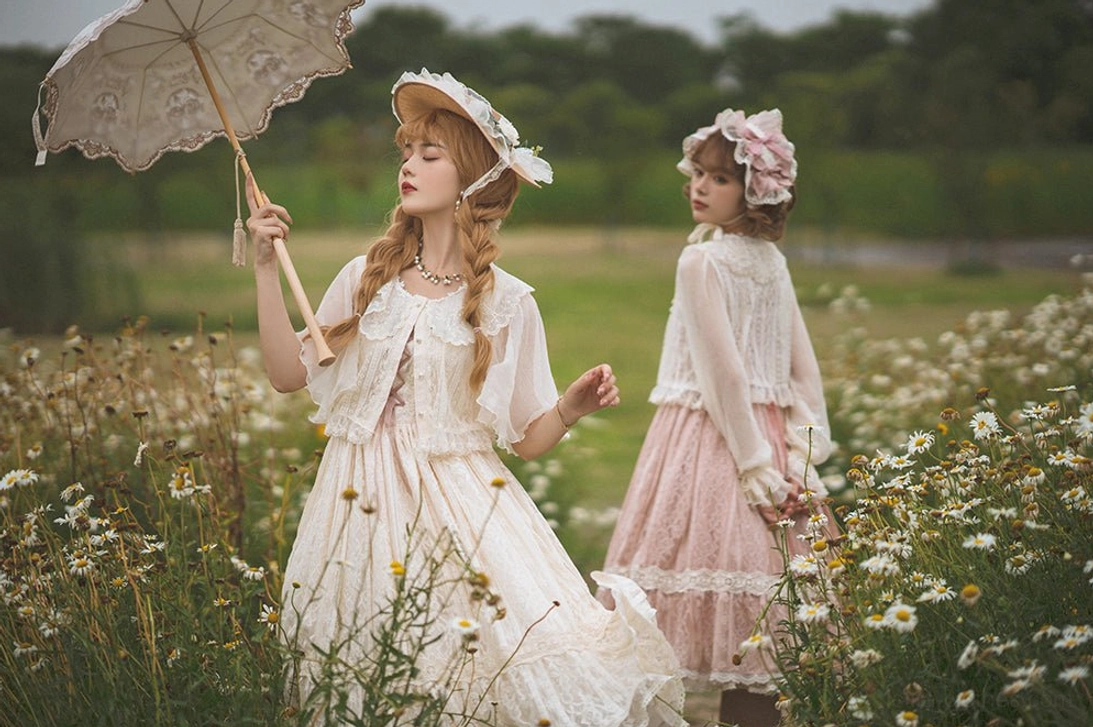 group lolita coordinate featuring retro blouse with pearl buttons vintage parasol and bonnets