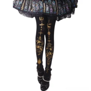 Halloween Gothic Lolita black pantyhose with golden rabbit and pumpkin prints, low angle leg view showing detailed golden motifs on black velvet tights paired with stained glass lace skirt and pearl mary jane shoes