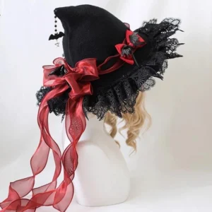 Halloween Lolita woolen witch hat with dark red satin bow and organza streamers, featuring black lace ruffled brim and bat bead hanging ornaments, left three-quarter view on mannequin