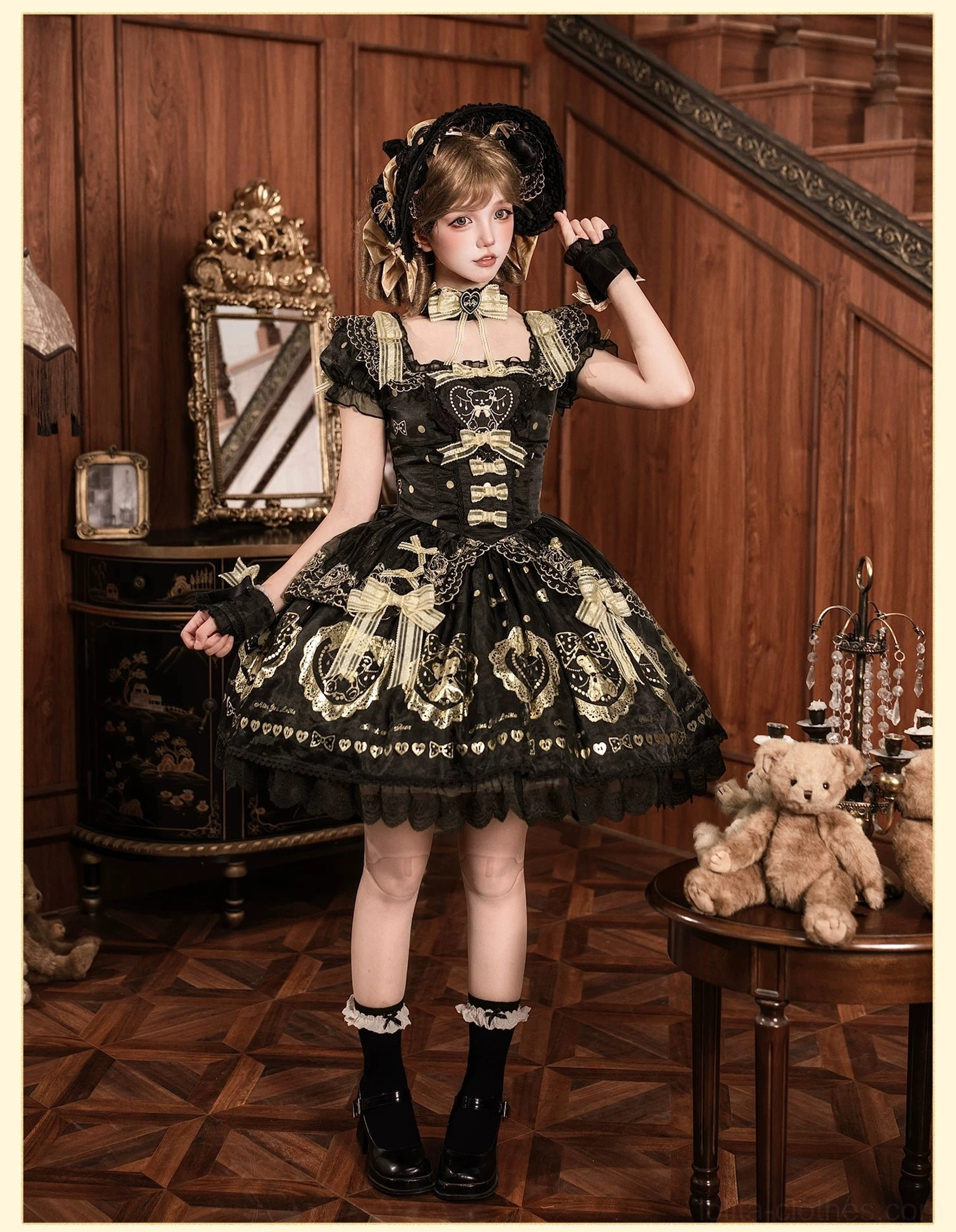 Alternative angle of halter-neck black and gold bear lolita dress on dress form, emphasizing halter neck bow detail, skirt volume, and gold bear print distribution across fabric