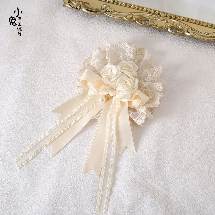 Hanamaru headdress brooch 2-in-1 design featuring fabric rose, layered satin bows and trailing lace ribbons on white background with gold frame