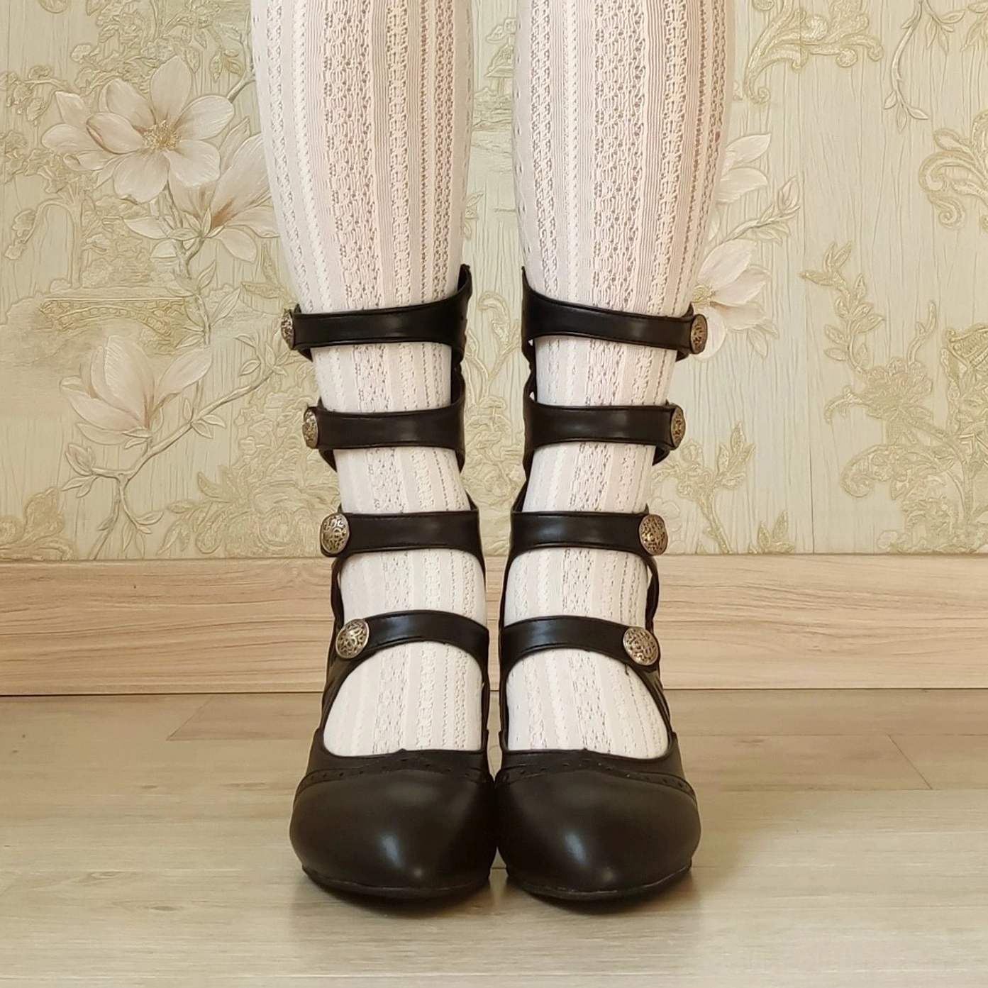 Handcrafted burgundy Lolita Mary Jane boots showing intricate floral hollow-out pattern and metal buckle details vintage-inspired design