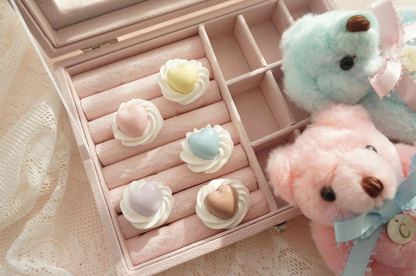 Handmade cream heart adjustable Lolita rings in five pastel colors displayed in a pink velvet jewelry box with lace and teddy bear decor