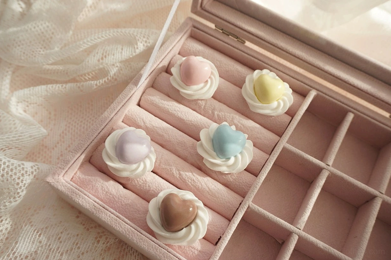 Pastel handmade cream heart adjustable Lolita rings displayed inside an open pink velvet jewelry box