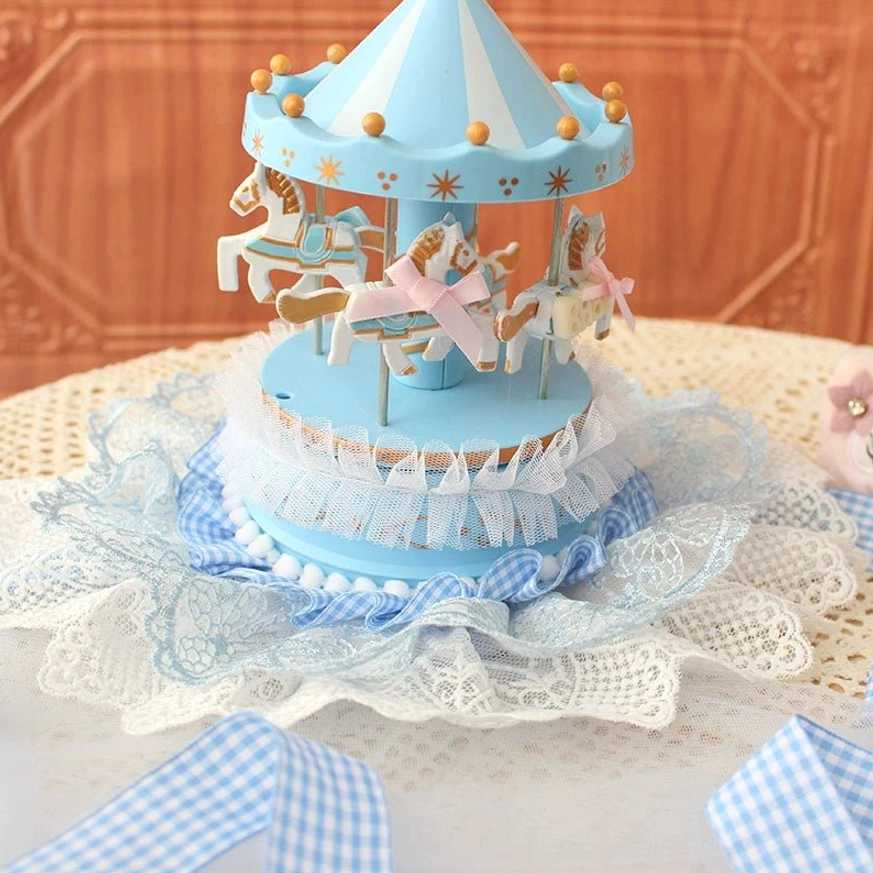 Sky blue lolita carousel mini top hat overhead close-up view showing all four decorated hand-painted carousel horses and rotating top mechanism