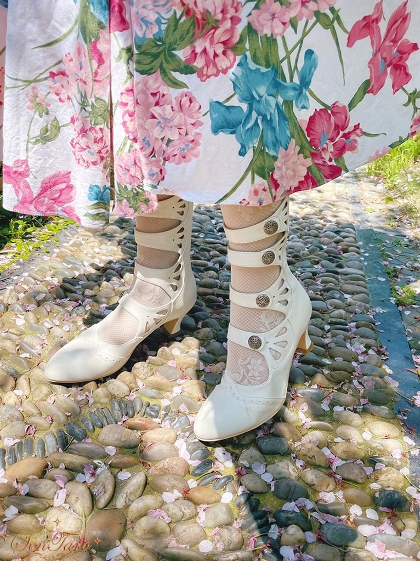 Handmade Lolita Mary Jane boots showing four-strap system with retro buckles and botanical hollow-out carved pattern