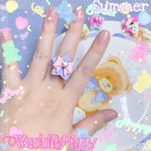 Handmade light purple pink star bow lolita adjustable ring with silver central gem kawaii style on hand