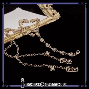 Hare Hunter champagne gold alloy Ouji Lolita waist chain flat lay with ornate floral carved links and openwork clasp