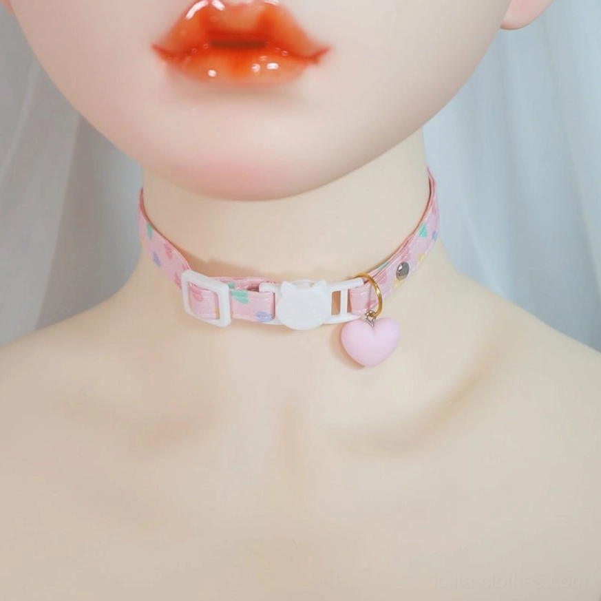 BJD doll wearing pastel heart print lolita choker with white cat buckle and pink heart pendant kawaii aesthetic close-up portrait