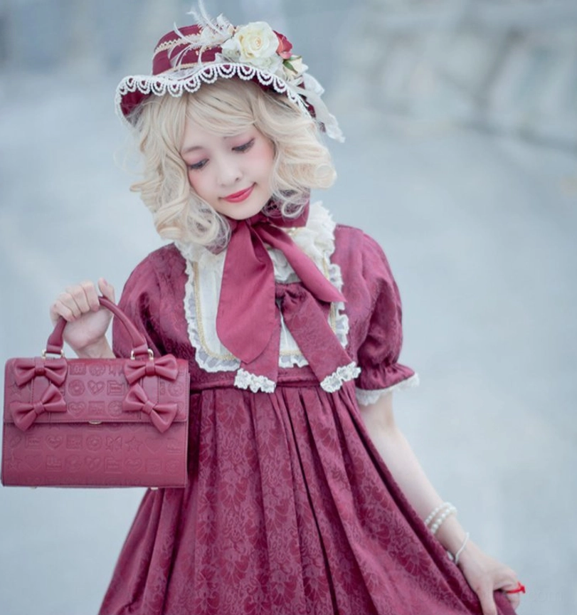 Heart embossed chocolate Lolita bow handbag bow decoration and hardware detail view