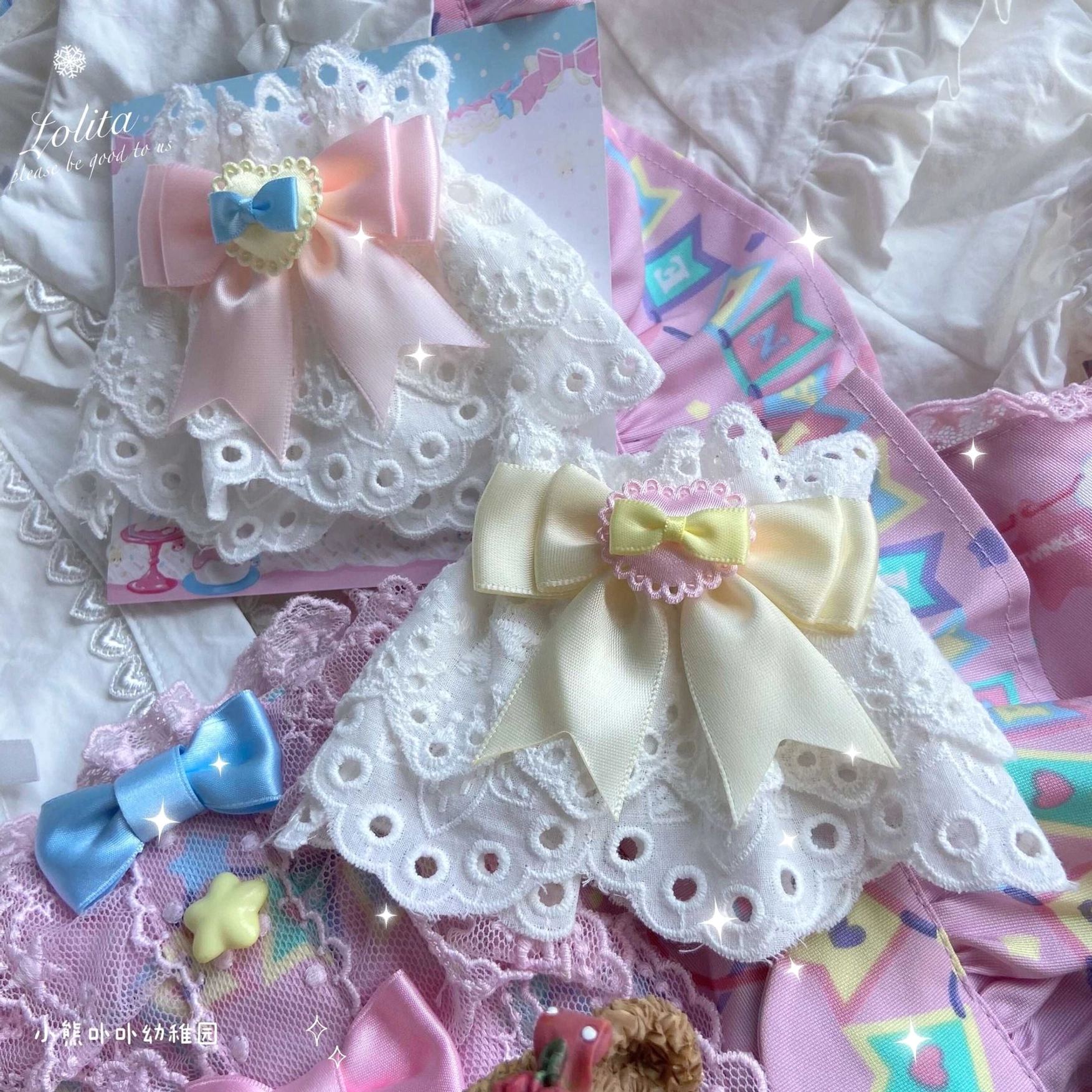 heart-shaped eyelet lace cutout detail white base pink cream satin bow lolita wrist cuff close-up