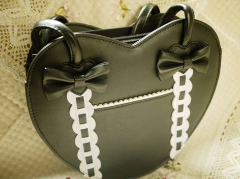 Heart-shaped Lolita tote bag bow accent detail close-up ribbon trim embellishment photography