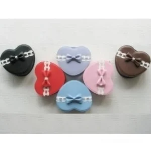 Collection of heart-shaped lolita mini bags in multiple colors with bows and chain trims flat lay display