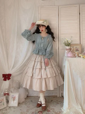 Heidi cotton lolita tiered SK skirt full-body front view worn with white blouse in vintage tea room setting