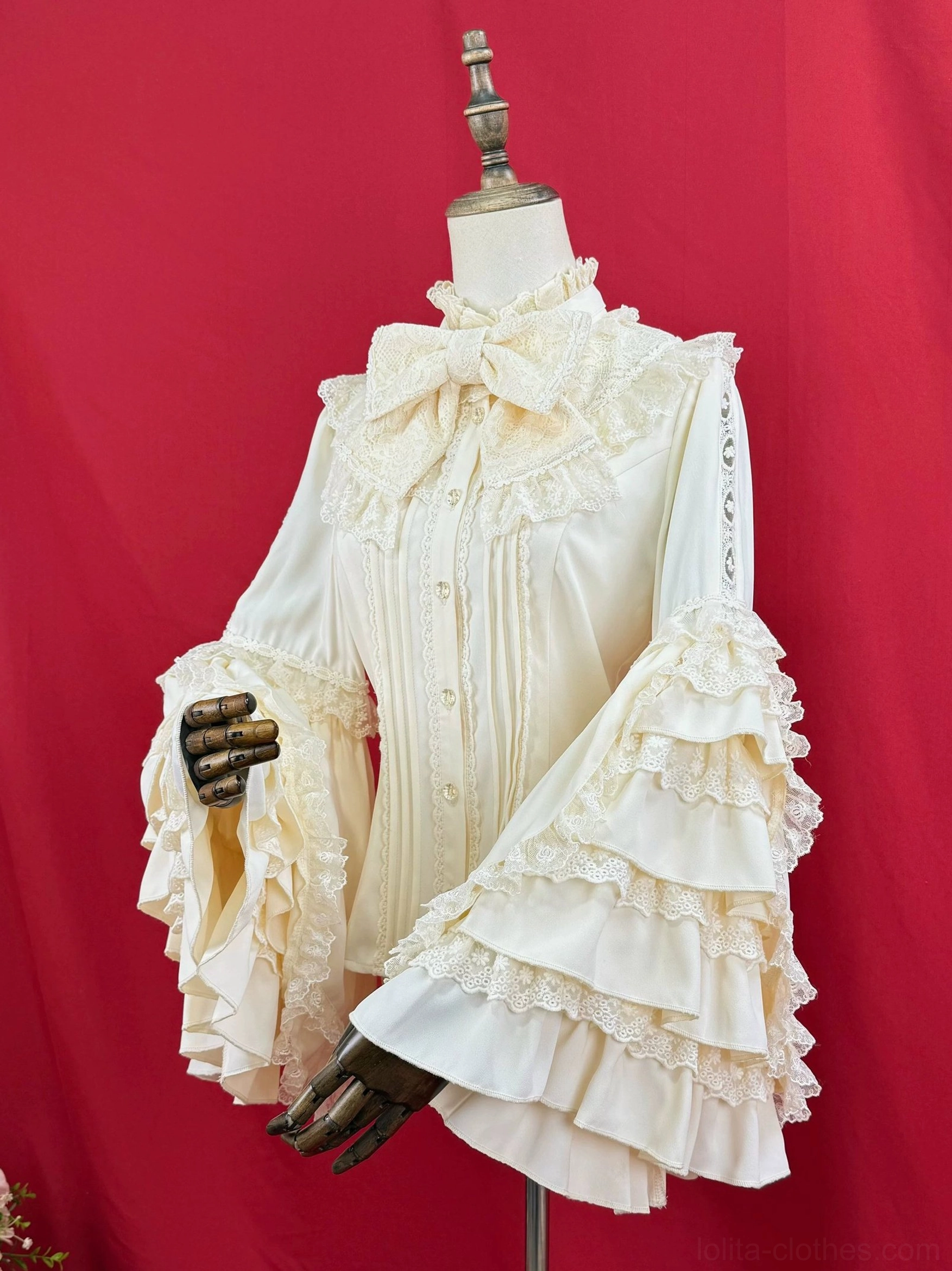 Hime sleeve Lolita blouse construction detail, showing precise seam work, lace trim application, ruffled sleeve construction, fabric texture and quality craftsmanship