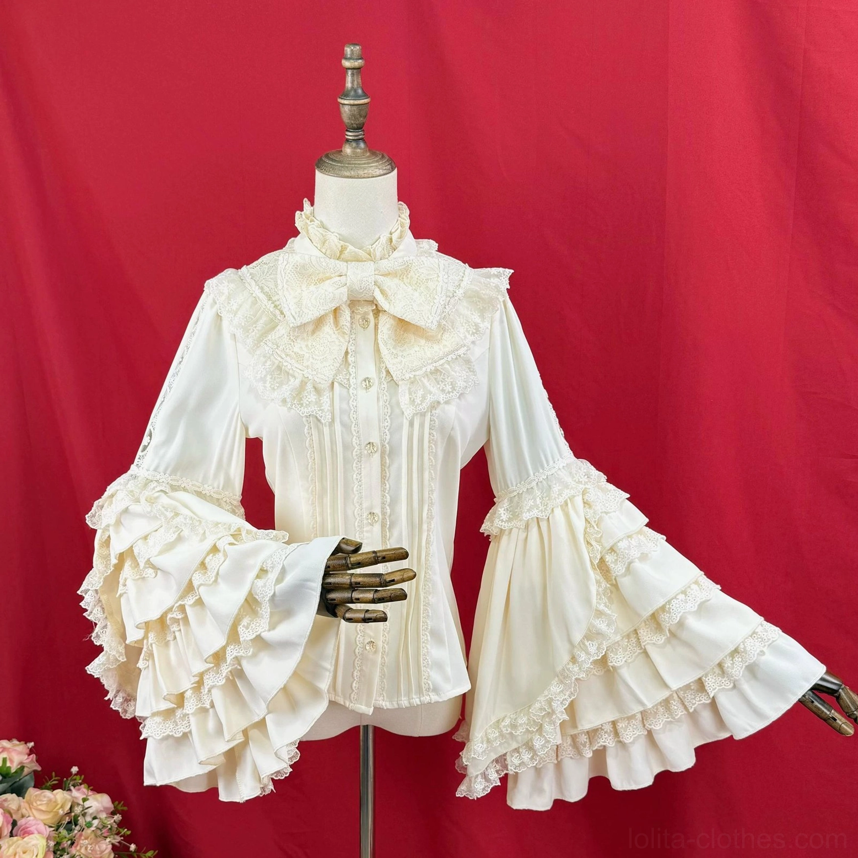 Hime sleeve Lolita blouse three-quarter front view with oversized detachable bow at stand collar, cream ivory, front lace pleated placket and wide ruffled sleeves