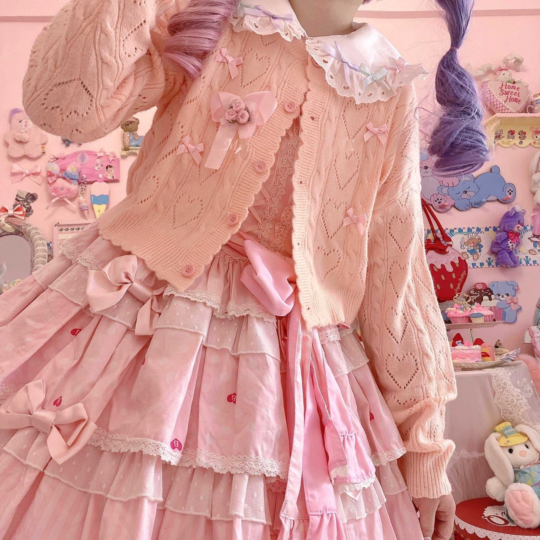 Hollow out long sleeve Lolita cardigan detail shot showcasing heart-shaped cutout pattern and cable knit texture, pilling-resistant arctic velvet material close-up