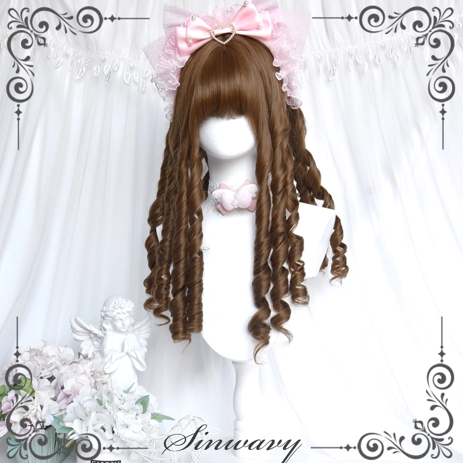 Front view of honey brown roman curl straight bangs lolita wig on mannequin with pink bow, displayed against white curtain backdrop with angel ornament and floral decoration