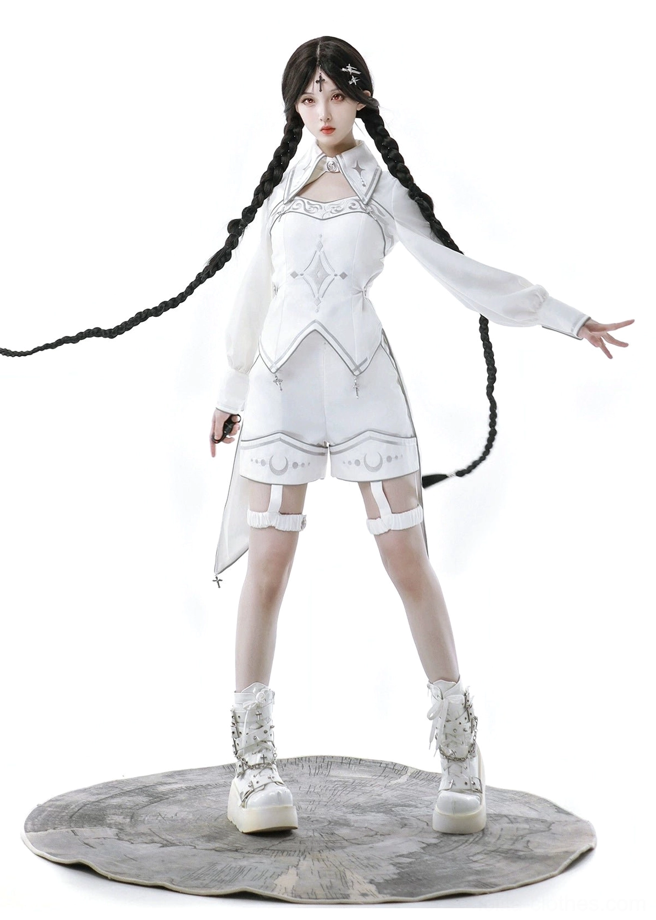 Detailed view of hooded white cyber-lolita cape showing draped hood design, irregular hemline with silver trim, split cape construction, and flowing silhouette