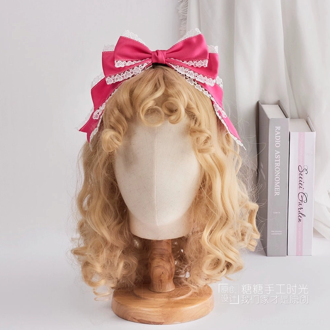 Bright hot pink satin sweet lolita oversized bow hair accessory decorated with white scalloped lace trims frontal view